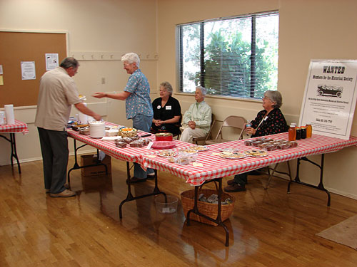 Daisy Cuddy,(seated in corner) Linda Marsee and helpers. Bake sale from home made pasteries are available here.