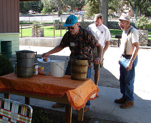 Curtis Newman (with suspenders),and Helpers, making Home made Ice-cream in old hand cranked ice cream maker.